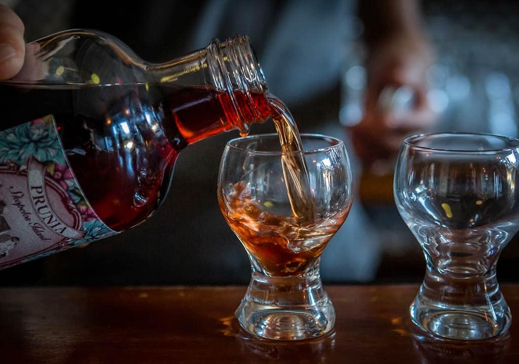 Serving Prunia plum & herb liqueur